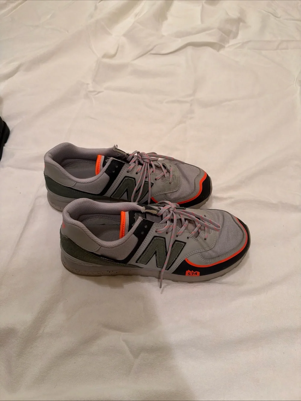New Balance 574 Men's Sneakers in Gray with Olive and Orange Accents Rain Cloud